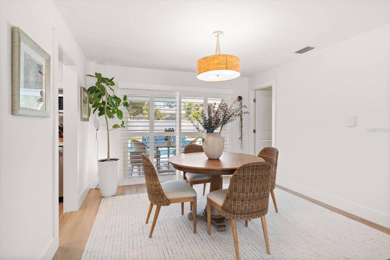 Dining Room looking oout over the beautiful Pool and Patio.