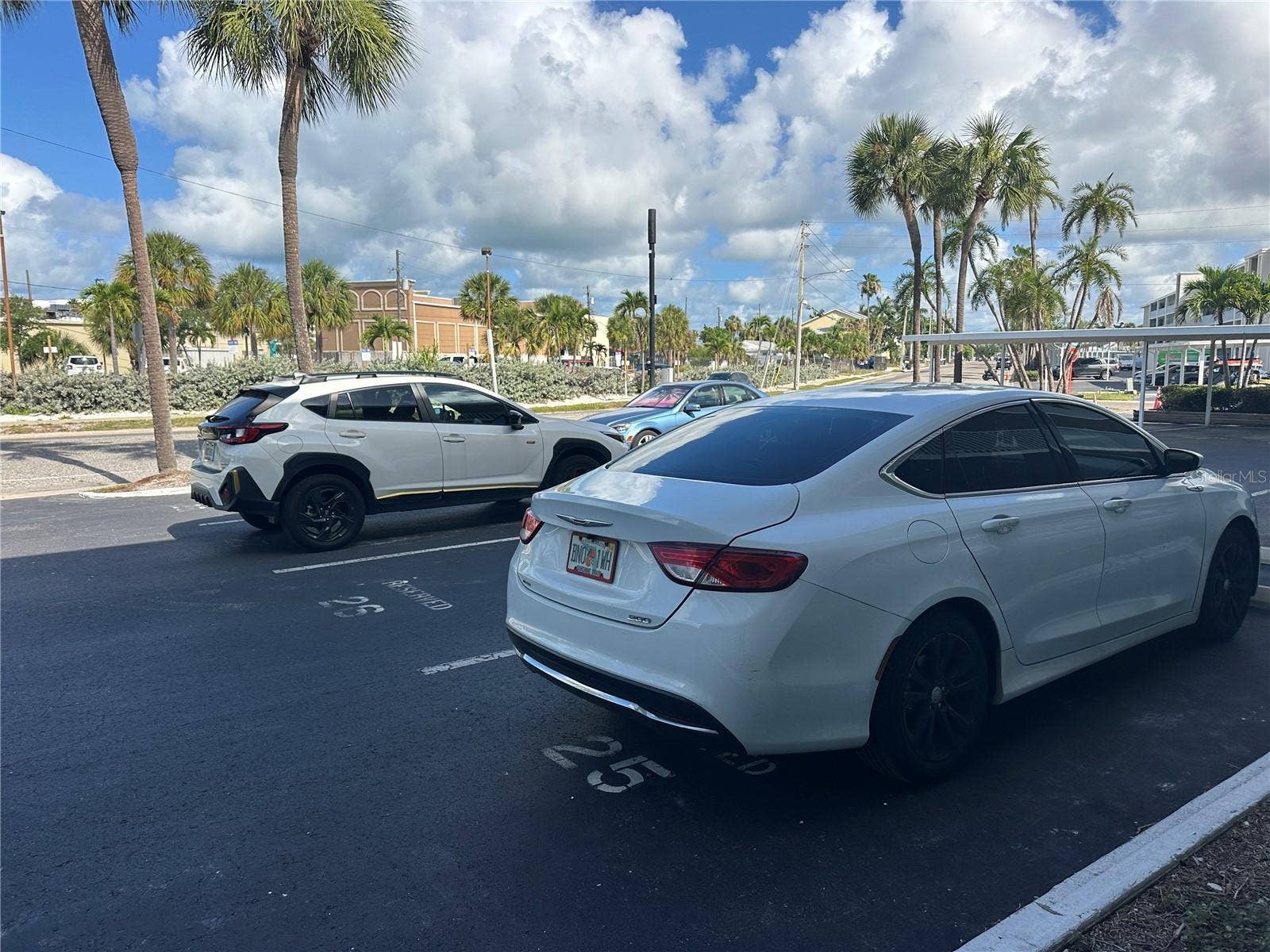 6161 GULF WINDS DRIVE, #150, St Pete Beach, FL 33706 Parking space 26 is in middle of 2 white cars.