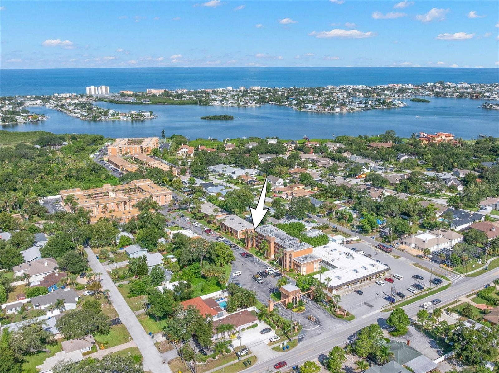 12760 INDIAN ROCKS ROAD, #107, Largo, FL 33774 The communitys location comes into focus from above, with the Intracoastal Waterway and Gulf of Mexico stretching across the horizon and Indian Rocks Beach just beyond.