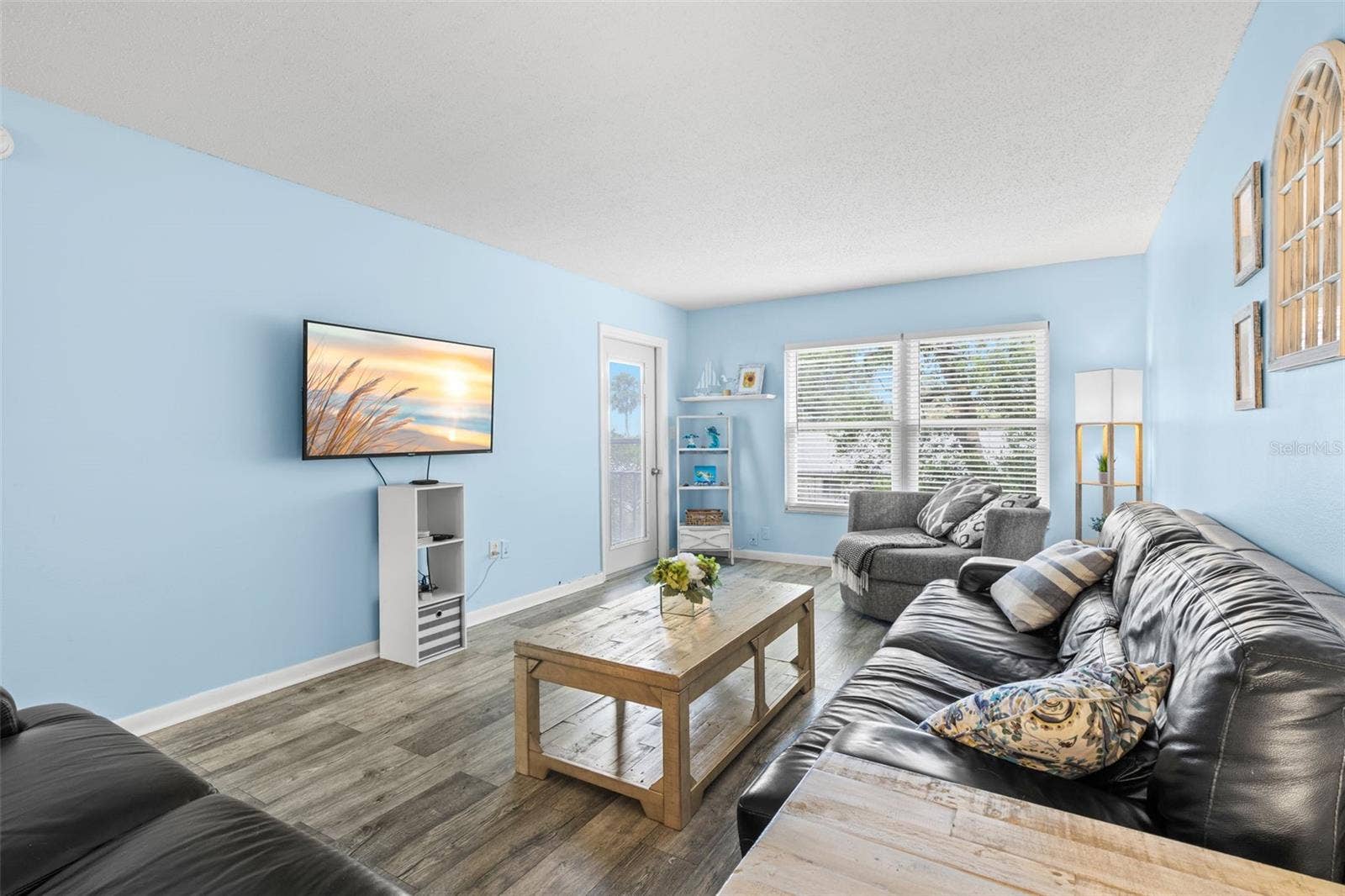 12760 INDIAN ROCKS ROAD, #107, Largo, FL 33774 At the far end of the living room, a broad window and a door to the screened balcony bring in natural light, while the rooms long proportions leave plenty of space for substantial seating and media furniture.