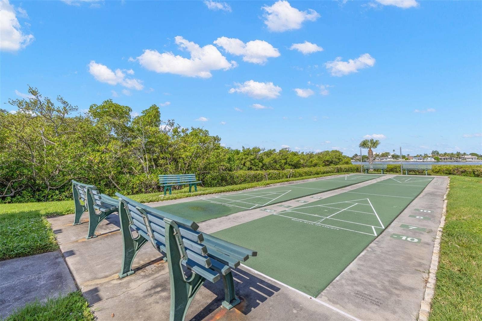 12760 INDIAN ROCKS ROAD, #107, Largo, FL 33774 Shuffleboard courts add another outdoor amenity, set against a backdrop of mangroves and a water view that gives this part of the community a distinctly coastal feel.