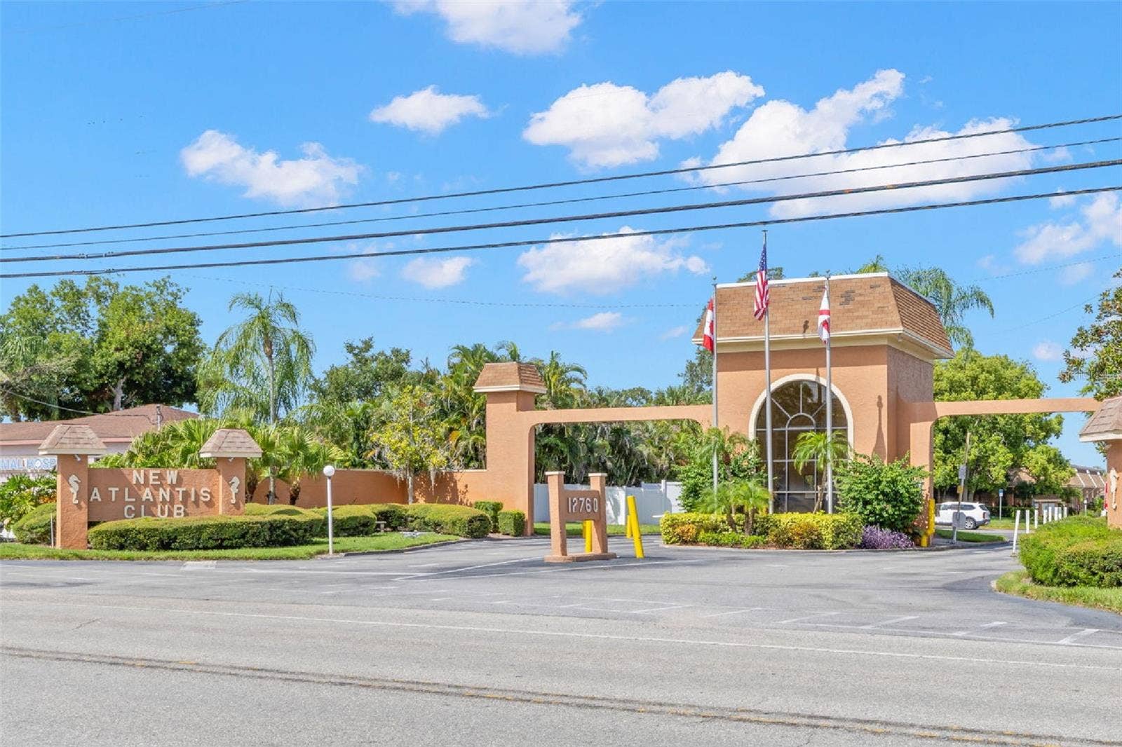 12760 INDIAN ROCKS ROAD, #107, Largo, FL 33774 The landscaped entrance to New Atlantis Club creates a defined arrival, with a gated entry, tropical plantings and the communitys signature architectural details setting the tone from the start.