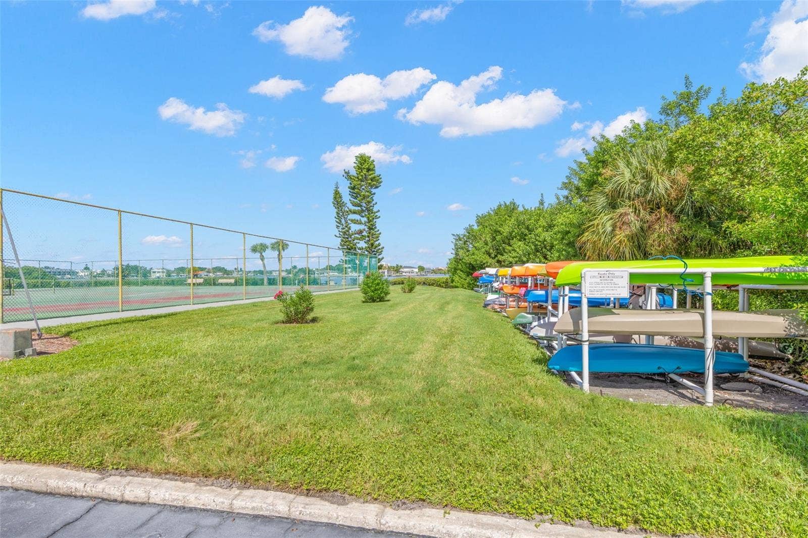 12760 INDIAN ROCKS ROAD, #107, Largo, FL 33774 Outdoor amenities continue with tennis courts alongside dedicated kayak storage, adding another recreational option within the New Atlantis Club community.