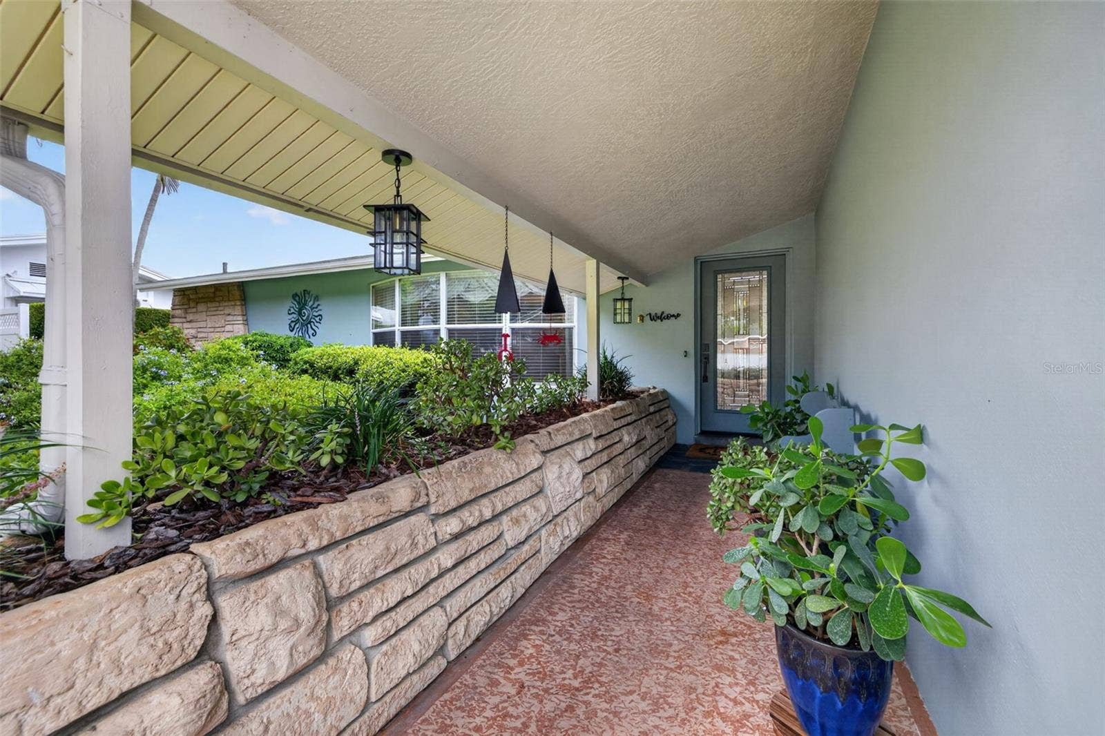 9795 PORTSIDE DRIVE, Seminole, FL 33776 Front Door and covered walkway