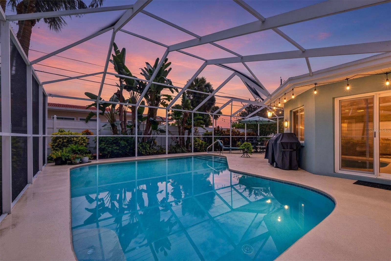 9795 PORTSIDE DRIVE, Seminole, FL 33776 Twilight Pool View