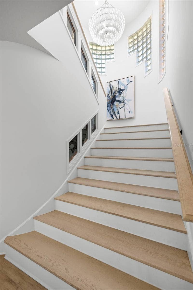 101 9TH STREET E, Tierra Verde, FL 33715 Staircase to Primary Upper Level