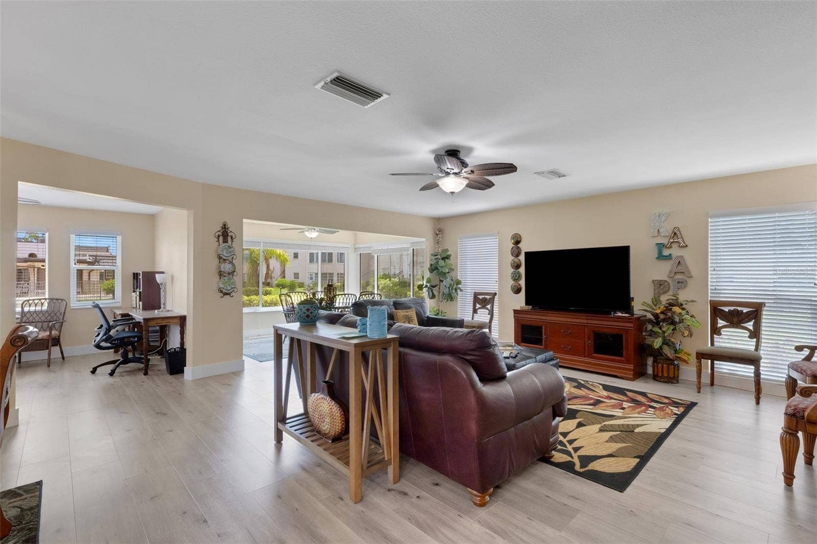 Living Room with Florida Room and 3rd Bedroom/Home Office on Left