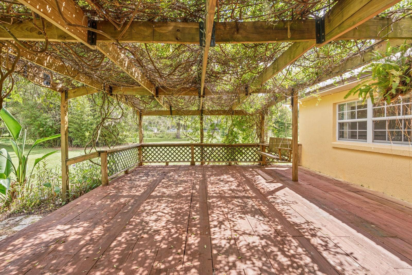 1435 CHERRY LANE, Lakeland, FL 33811 Patio with flowering vines