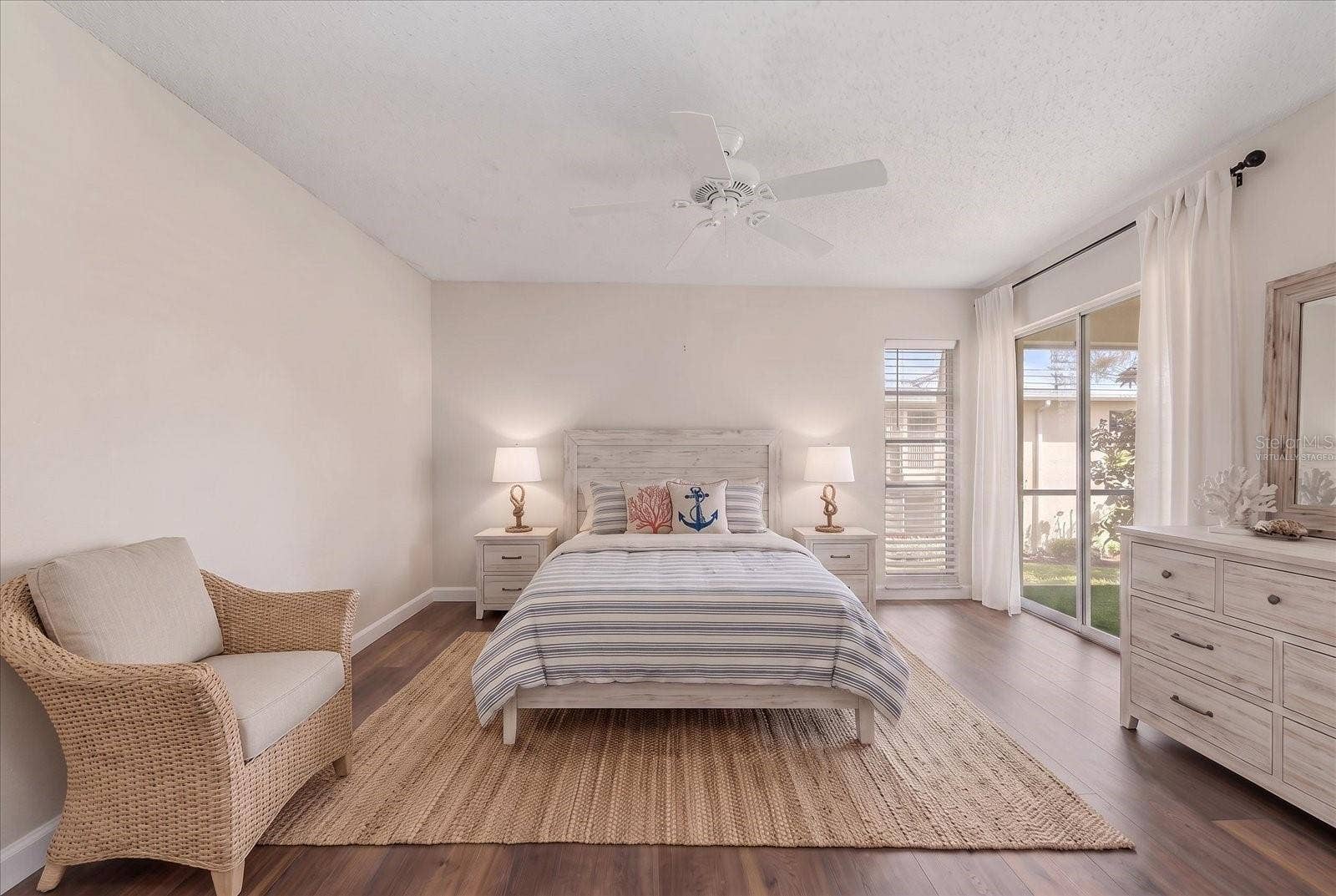 1975 W BAY DRIVE, #109, Largo, FL 33770 Primary bedroom with sliding glass to screened lanai. Virtually staged