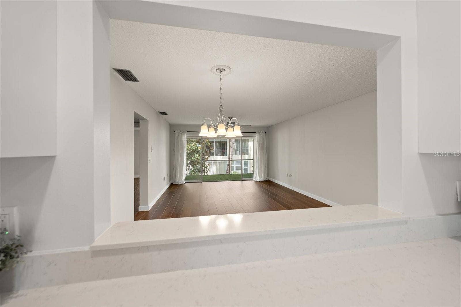 1975 W BAY DRIVE, #109, Largo, FL 33770 Pass through from kitchen to dining room, living room and screened in lanai.