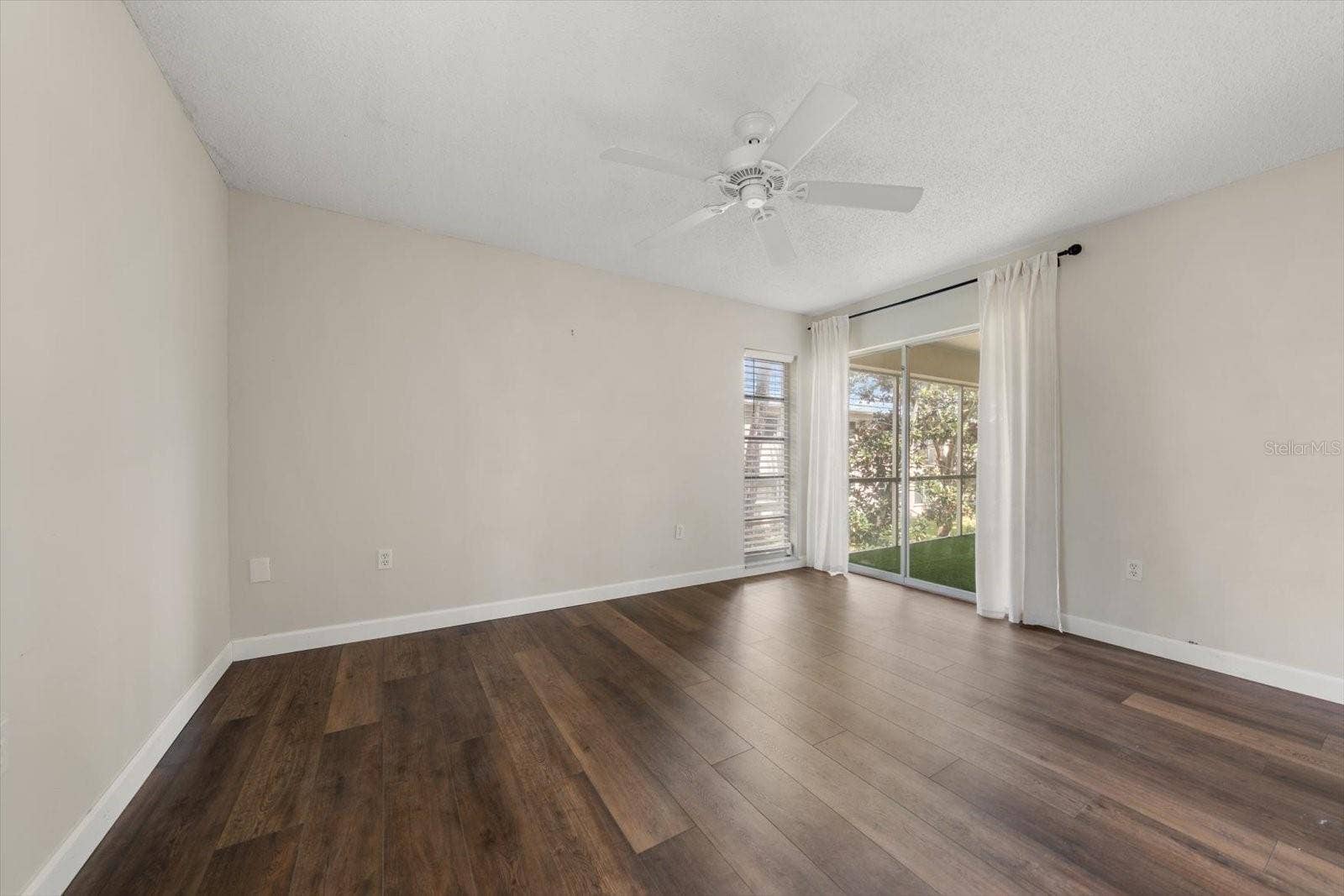 1975 W BAY DRIVE, #109, Largo, FL 33770 Primary bathroom with sliding glass doors to screened lanai