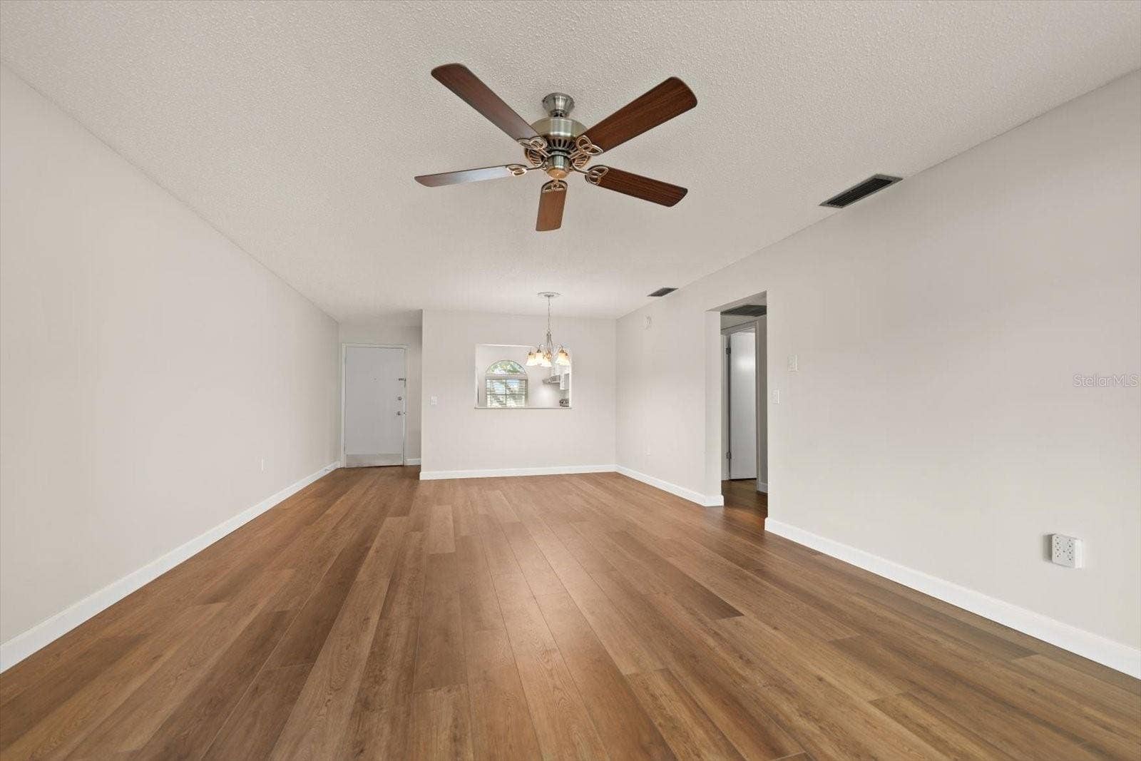 1975 W BAY DRIVE, #109, Largo, FL 33770 Living room, dining room, pass through to kitchen and front door