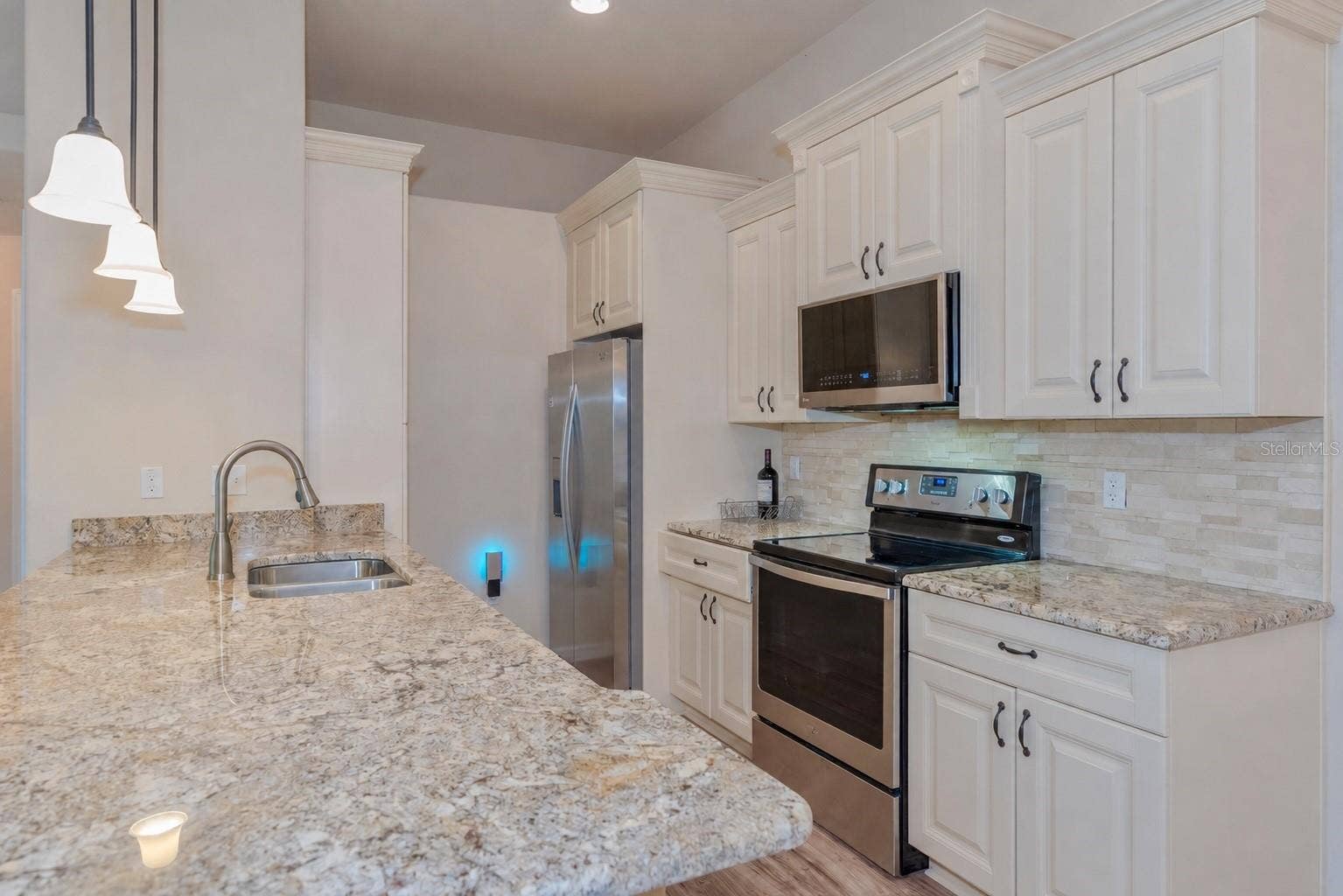 5065 ROYAL PALMS WAY, #303, New Port Richey, FL 34652 Kitchen with granite countertops.