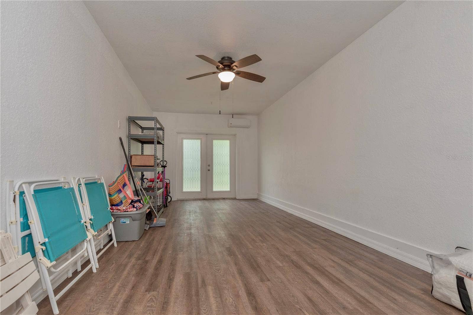 5065 ROYAL PALMS WAY, #303, New Port Richey, FL 34652 Downstairs storage room is air conditioned with a mini split.