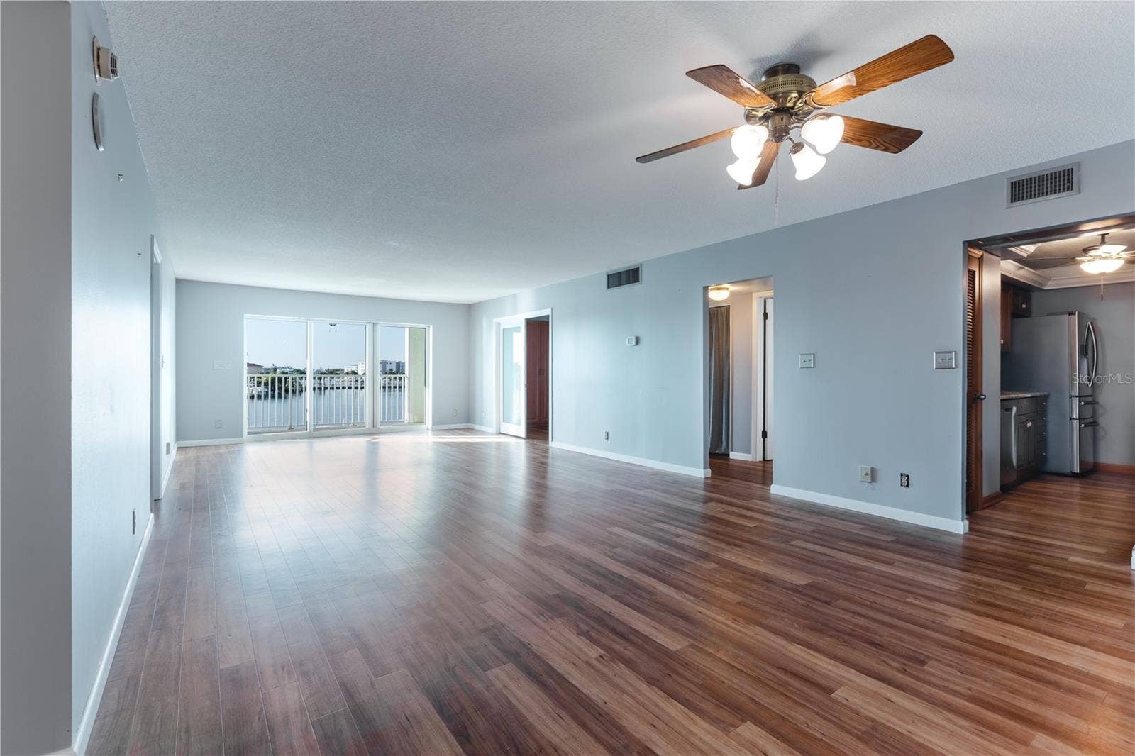 400 64TH AVENUE, #305, St Pete Beach, FL 33706 Living Room Dining Room Combo with Balcony Views