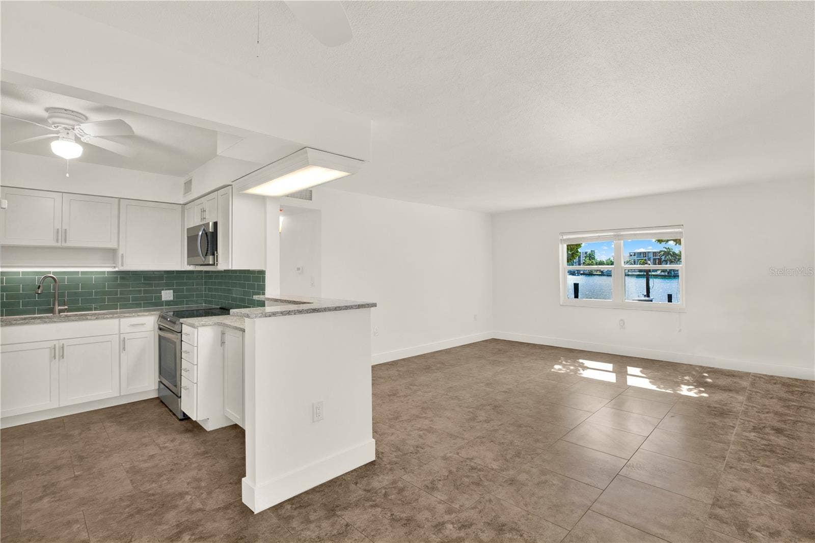 283 104TH AVENUE, #106, Treasure Island, FL 33706 Open Kitchen and Living Area