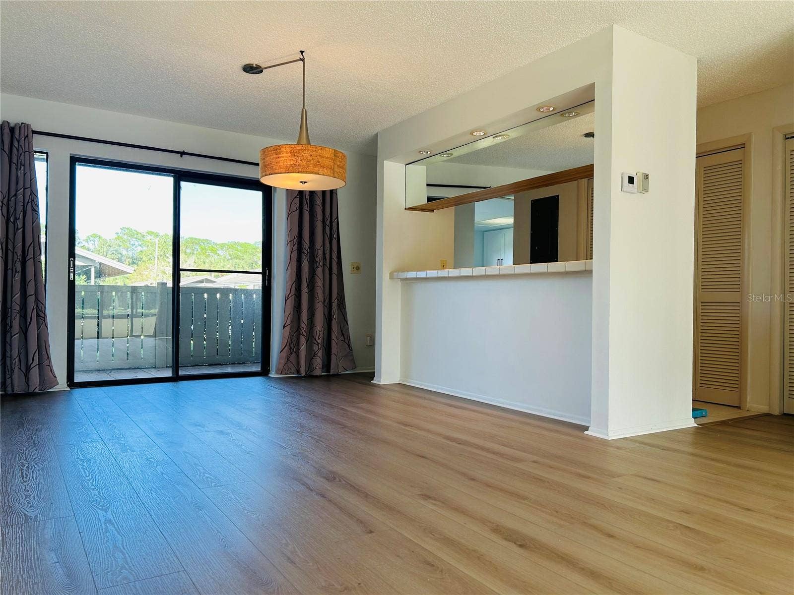 60 KAY COURT, Oldsmar, FL 34677 Dining room with breakfast bar and inside laundry closet