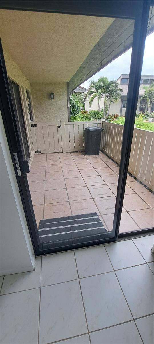 60 KAY COURT, Oldsmar, FL 34677 Cover front patio off the kitchen and dining room