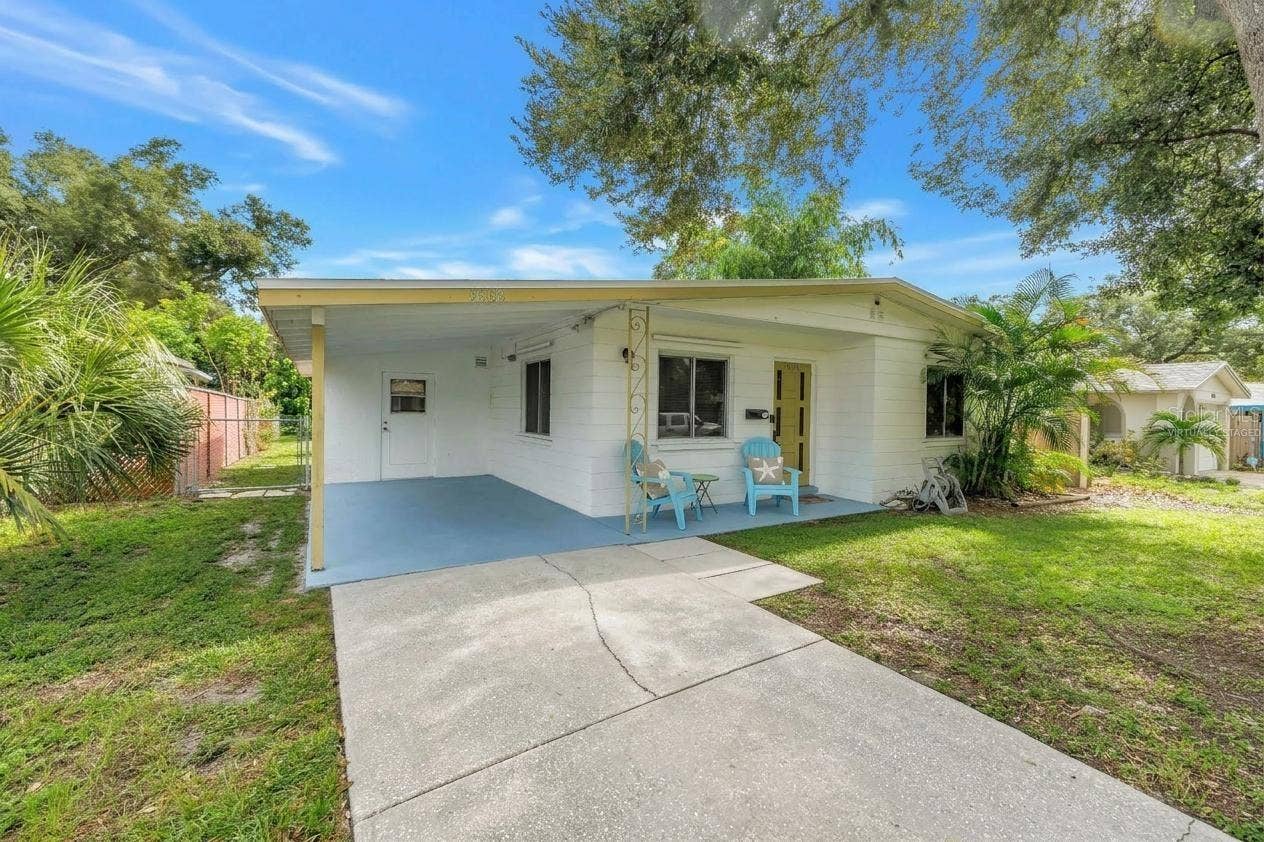 8068 28TH AVENUE N, St Petersburg, FL 33710 Virtually staged front chairs and pillows