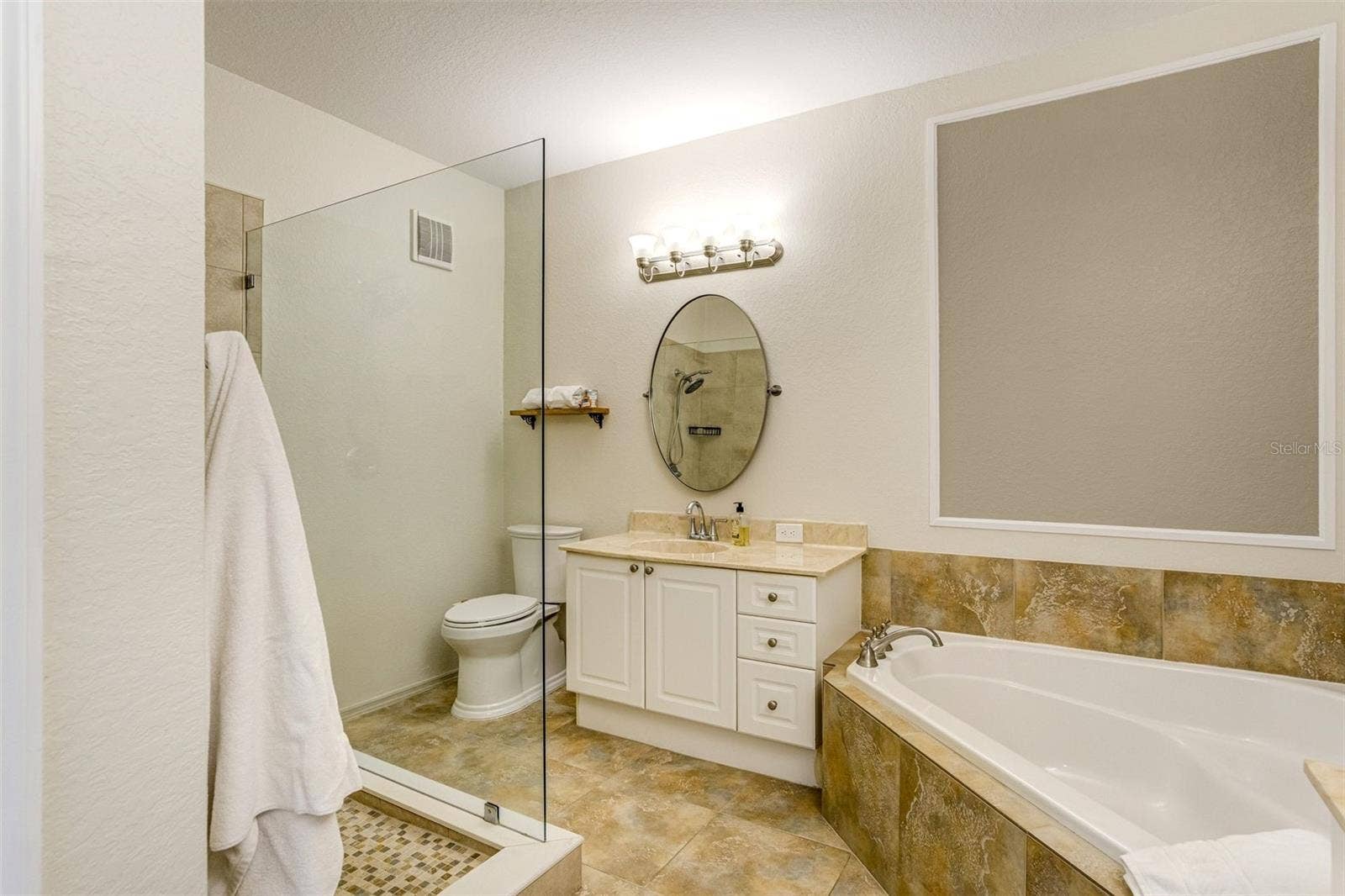 2730 VIA TIVOLI, #334B, Clearwater, FL 33764 Spa like bathroom with garden tub, walk in shower and dual vanities