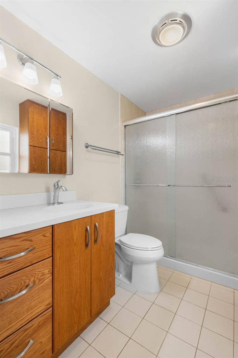1519 FORT DUQUESNA DRIVE, Sun City Center, FL 33573 Updated bathroom with floor to ceiling tile shower, counter height vaniety