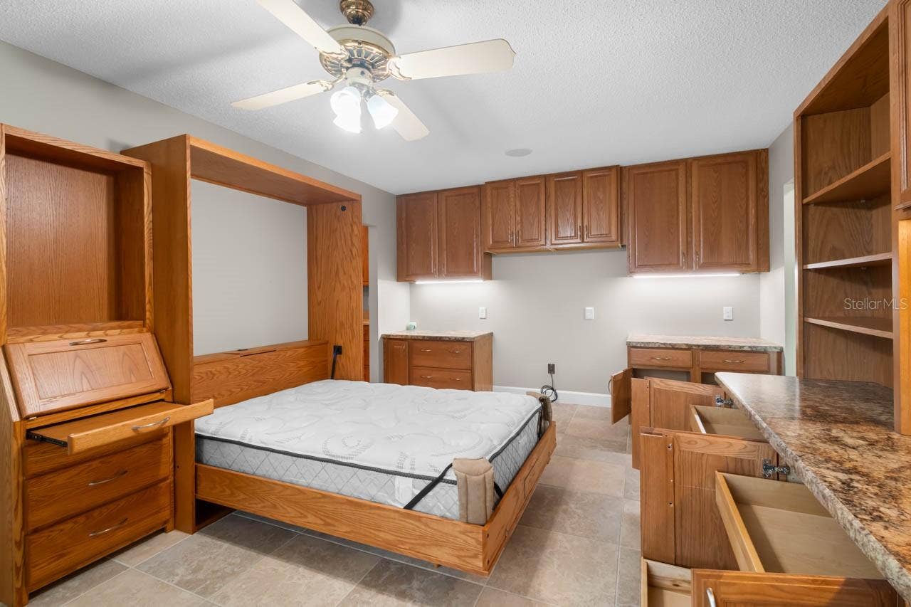 1519 FORT DUQUESNA DRIVE, Sun City Center, FL 33573 Murphy bed with side table cabinet