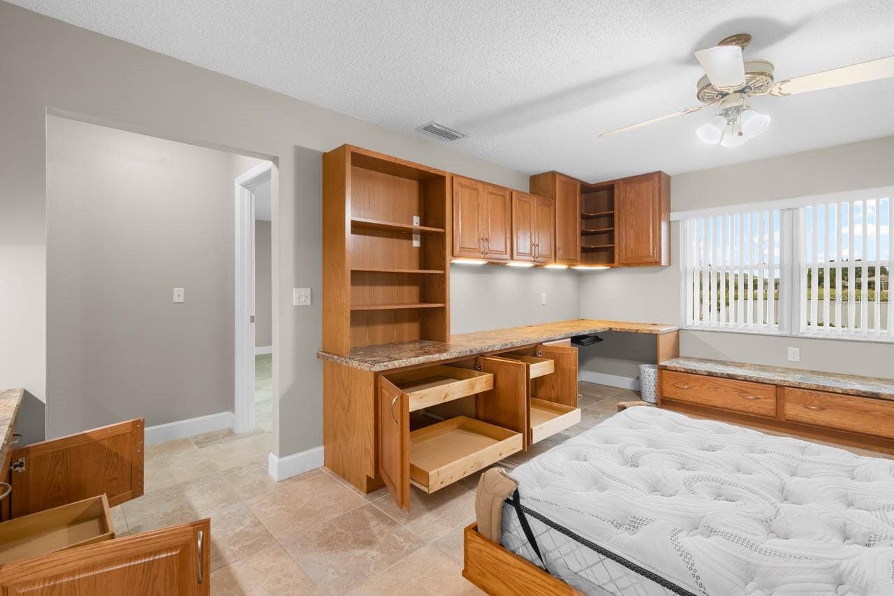 1519 FORT DUQUESNA DRIVE, Sun City Center, FL 33573 Office cabinets all with pull outs