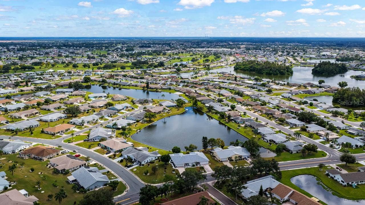 1519 FORT DUQUESNA DRIVE, Sun City Center, FL 33573 Quail Lake in the forefront, Mirror Lake in the back