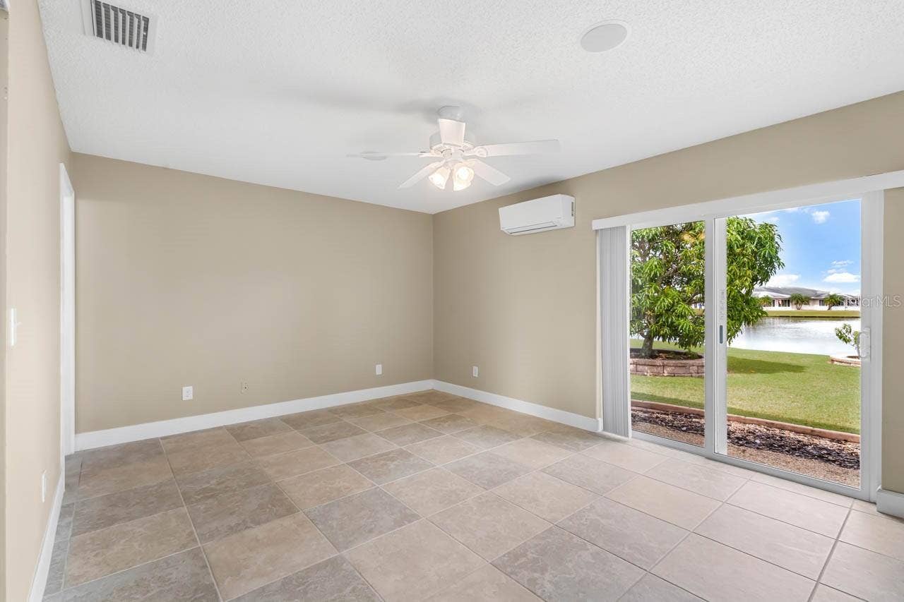 1519 FORT DUQUESNA DRIVE, Sun City Center, FL 33573 Primary bedroom has wonderful lake view