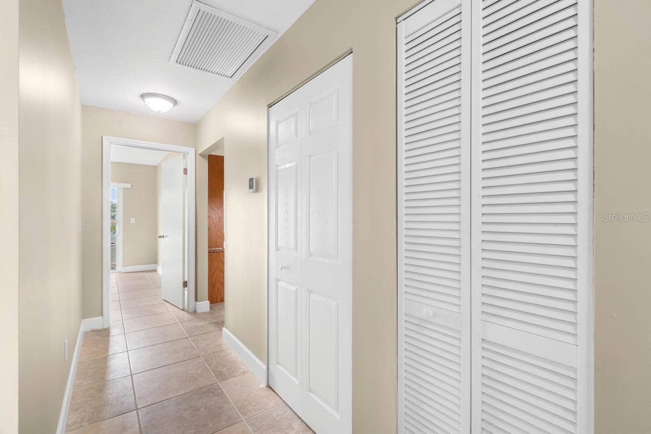 1519 FORT DUQUESNA DRIVE, Sun City Center, FL 33573 Hallway has extra linen closet