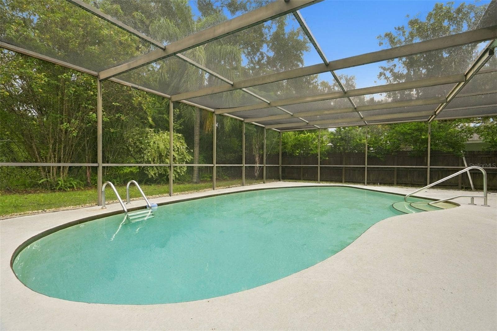 Screened enclosed pool area.