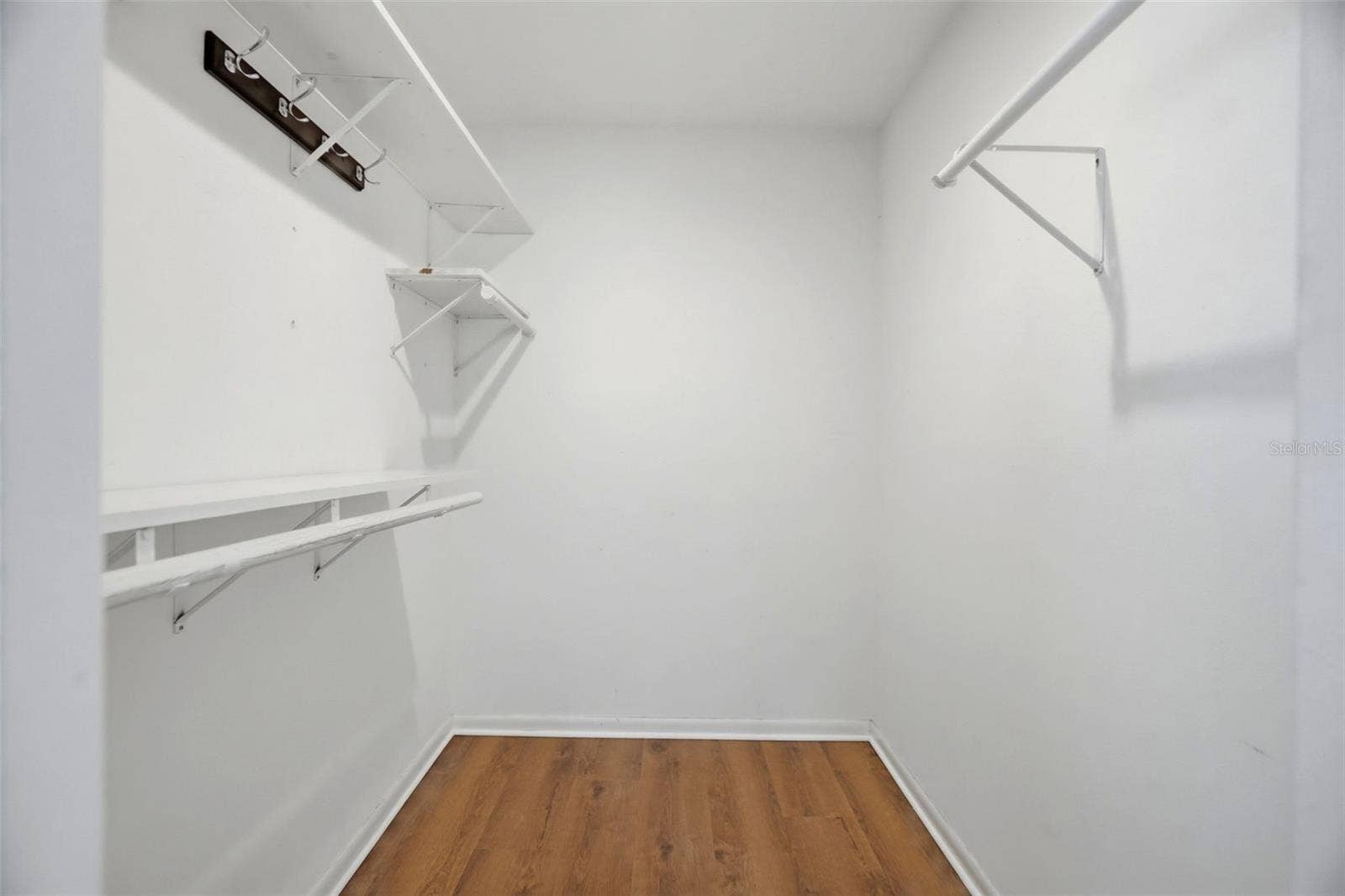 Walk-in closet in the primary bedroom.