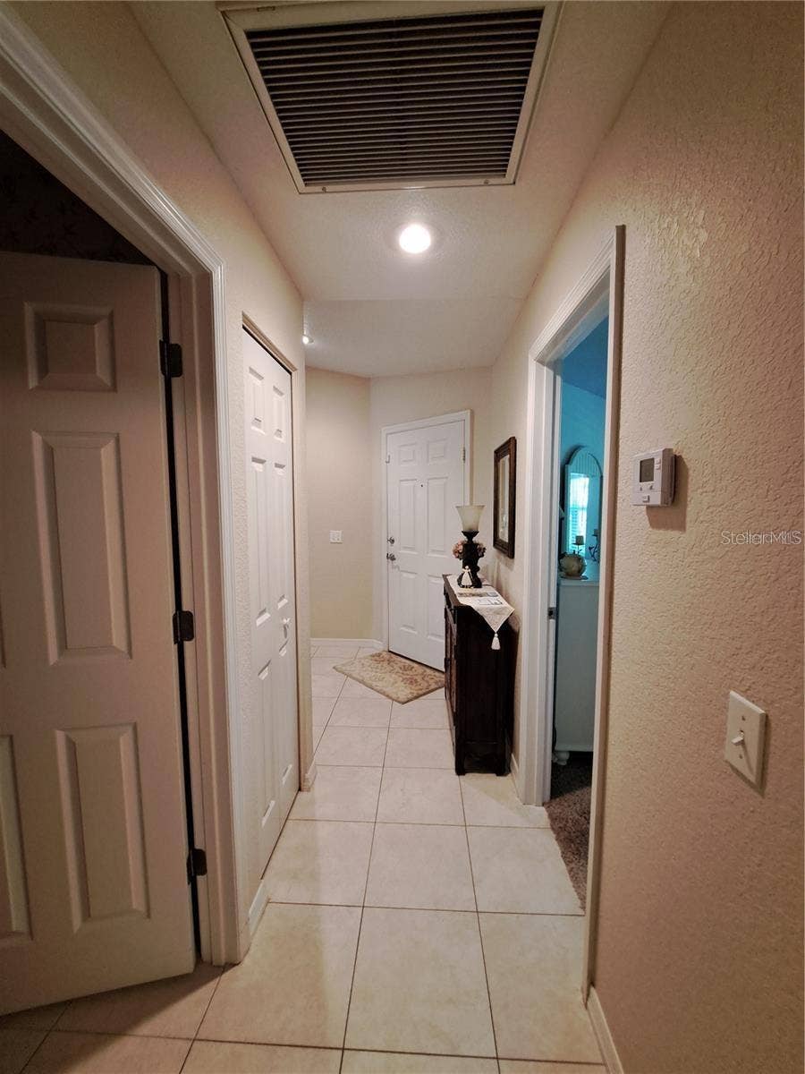 5316 LOCHMEAD TERRACE, Zephyrhills, FL 33541 left side walkway when enter home door