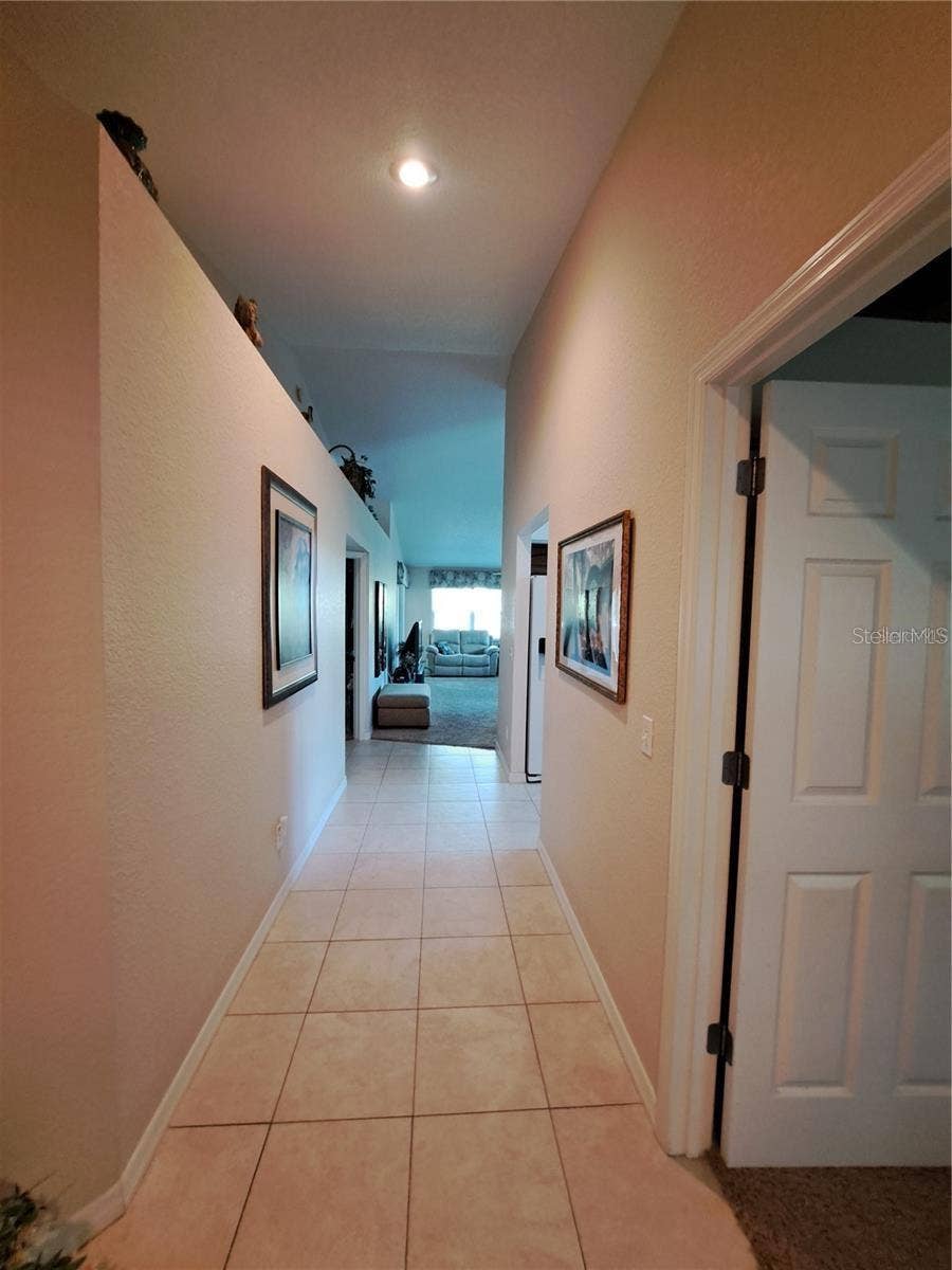 5316 LOCHMEAD TERRACE, Zephyrhills, FL 33541 hallway to master, LR and kitchen as a part of this Split Plan