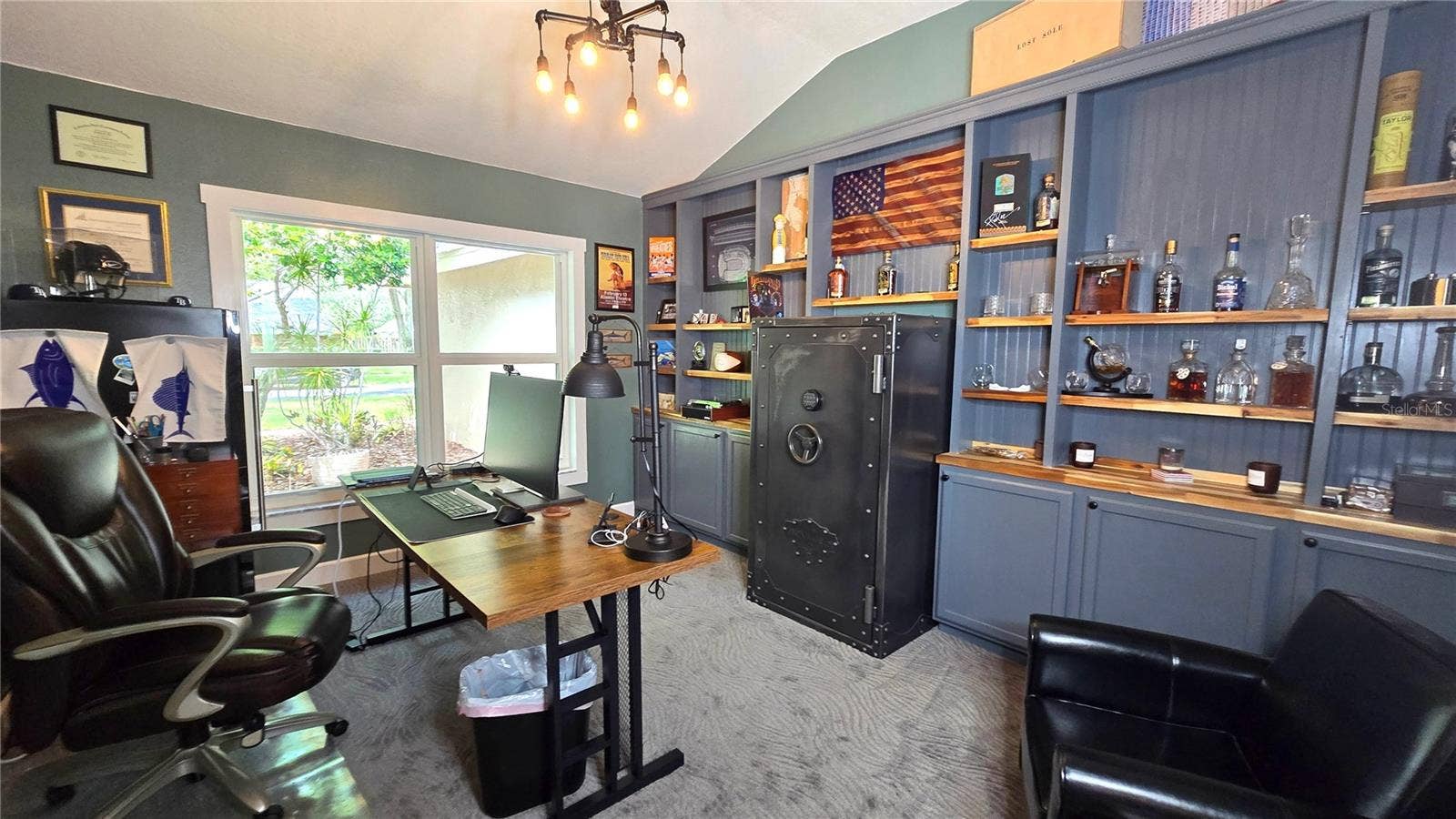 9991 WINDTREE BOULEVARD, Seminole, FL 33772 This office is perfect for those who work from home or may just want a gaming room. It very spacious with lots of shelves and cabinets.