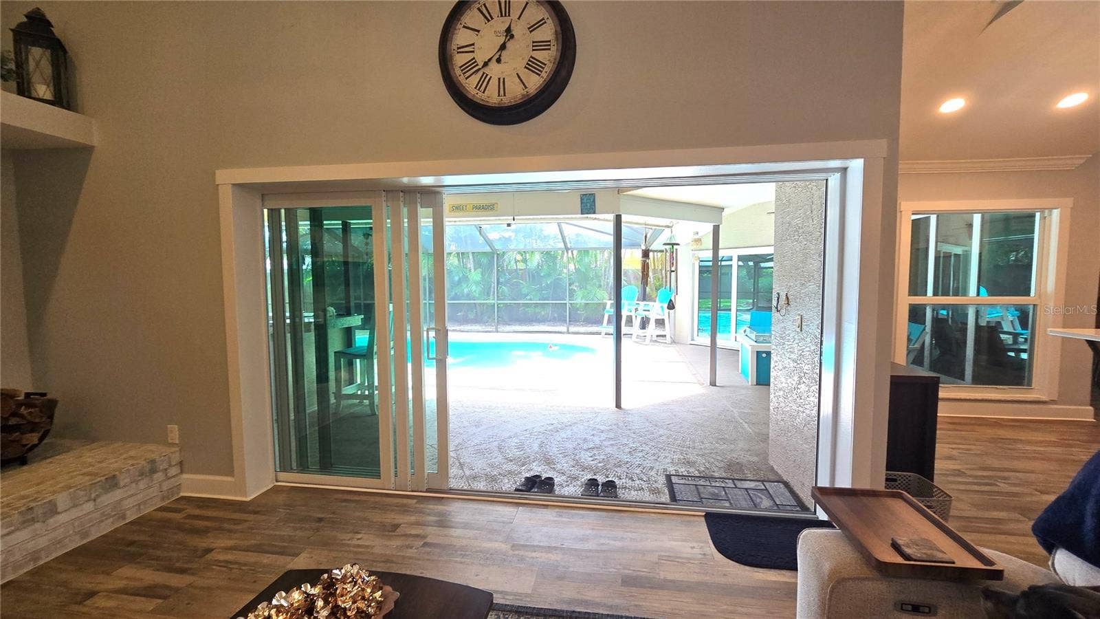 9991 WINDTREE BOULEVARD, Seminole, FL 33772 View of the pool area from the family room.