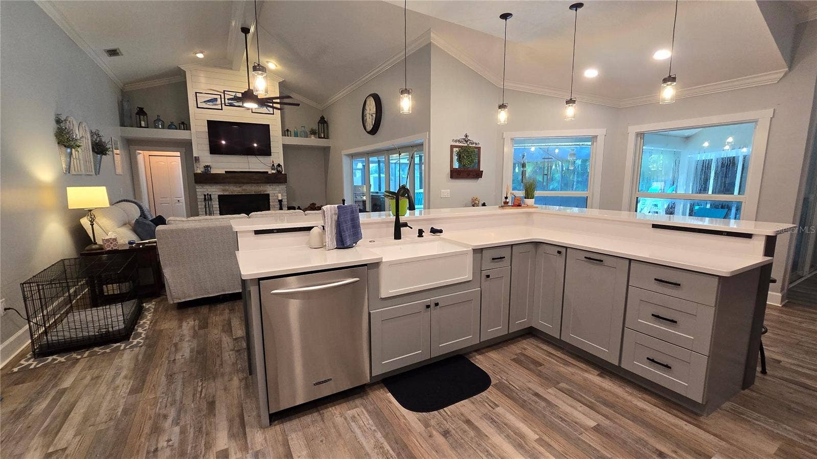 9991 WINDTREE BOULEVARD, Seminole, FL 33772 Kitchen overlooks the family room as well views of the outdoor screened in pool area. No more missing out on the get togethers. Lots of sitting area around the breakfast bar.