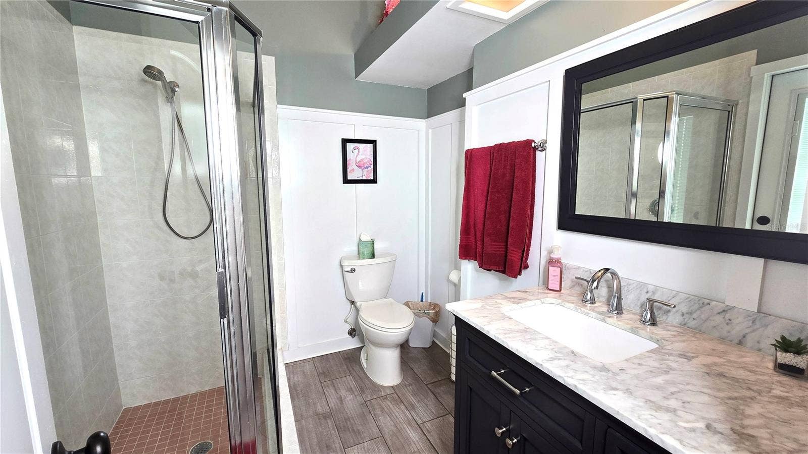 9991 WINDTREE BOULEVARD, Seminole, FL 33772 Full 3rd bathroom. This bathroom has an access door to the back yard pool area.