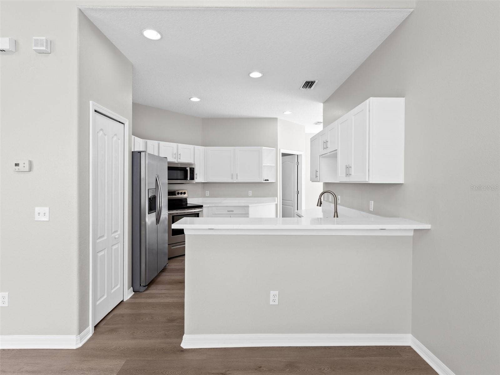 17912 HAVENVIEW LANE, Lutz, FL 33558 Kitchen with breakfast bar open to living room and dining room