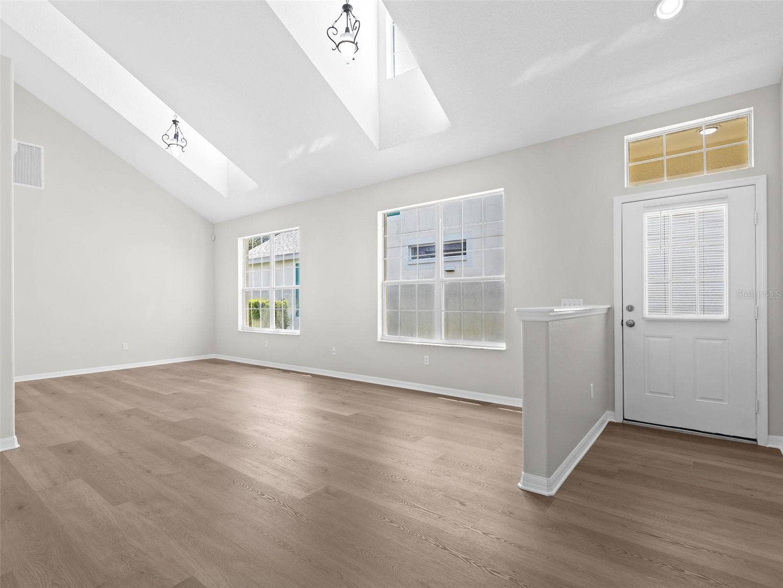 17912 HAVENVIEW LANE, Lutz, FL 33558 Living room and Dining room with skylights