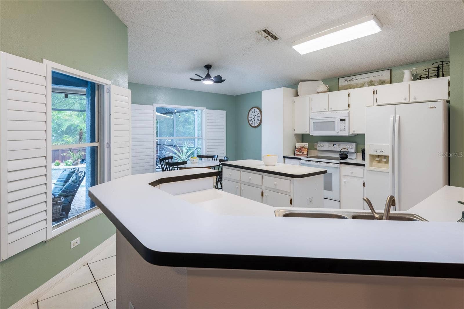 Kitchen has lots of cabinets and counter space for the cook in the family!