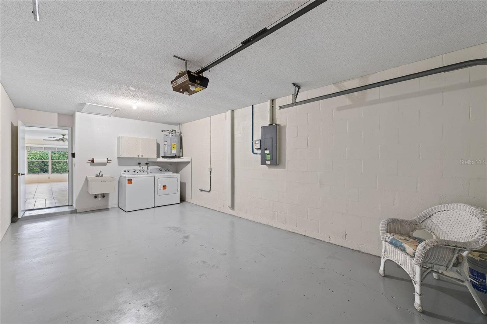 9545 DANVILLE COURT, #42, New Port Richey, FL 34655 Oversized Garage & Laundry Area- 9545 Danville Court, #42, New Port Richey, FL 34655Wedgewood Village Condos in Heritage Lake