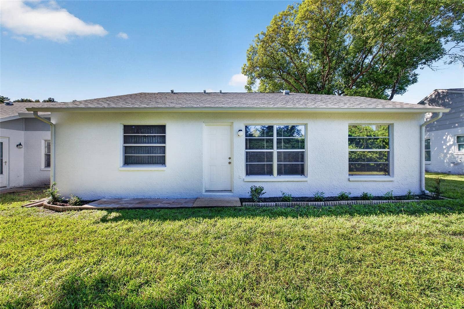 9545 DANVILLE COURT, #42, New Port Richey, FL 34655 Rear View- 9545 Danville Court, #42, New Port Richey, FL 34655Wedgewood Village Condos in Heritage Lake