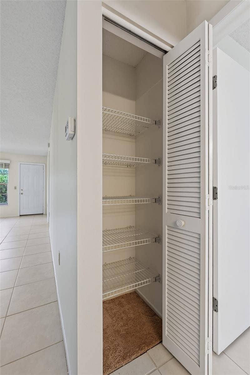 9545 DANVILLE COURT, #42, New Port Richey, FL 34655 Linen Closet by Front Bedroom- 9545 Danville Court, #42, New Port Richey, FL 34655Wedgewood Village Condos in Heritage Lake