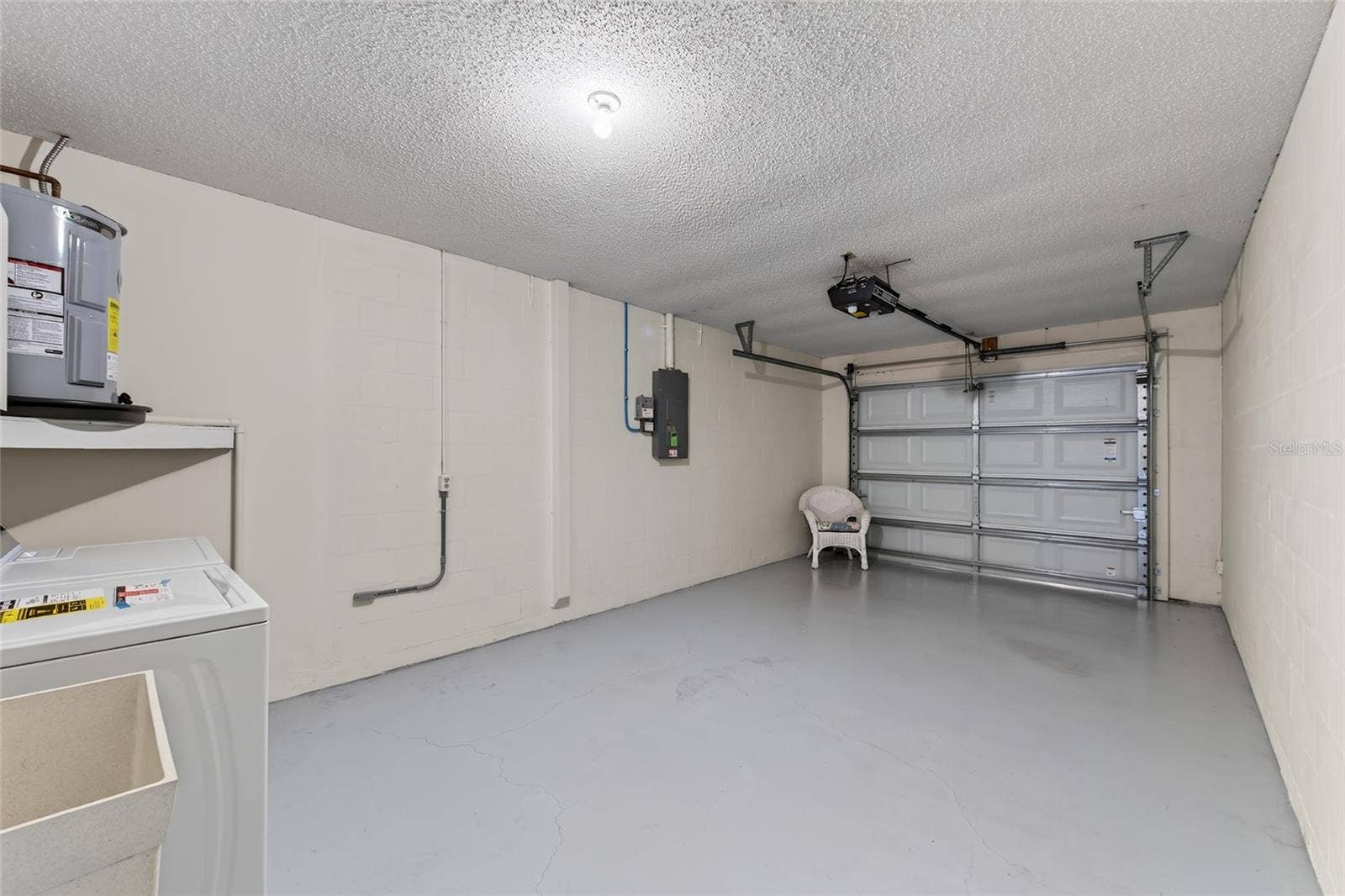 9545 DANVILLE COURT, #42, New Port Richey, FL 34655 Oversized Garage & Laundry Area- 9545 Danville Court, #42, New Port Richey, FL 34655Wedgewood Village Condos in Heritage Lake