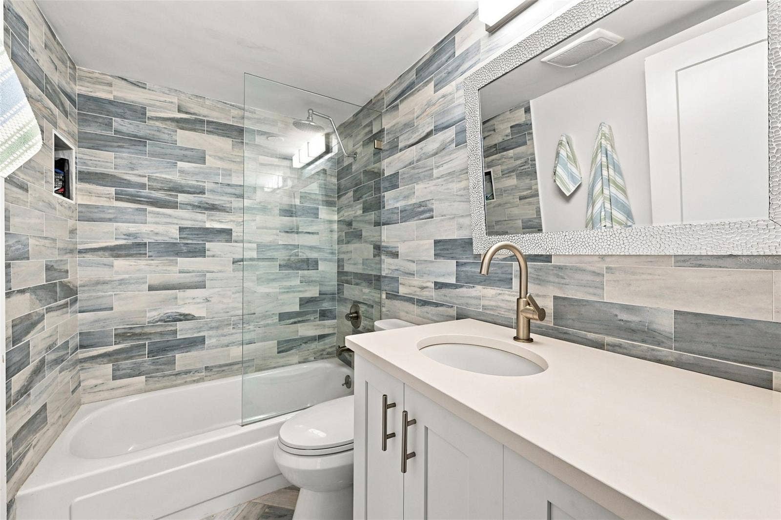 1898 SHORE DRIVE S, #208, South Pasadena, FL 33707 Beautiful guest bathroom with a shower tub combo