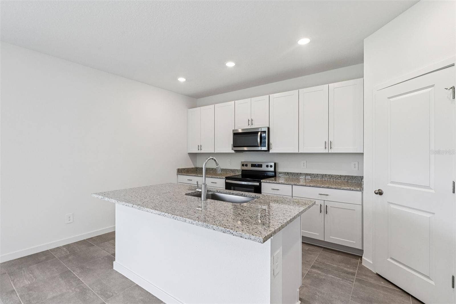 The interior photos are of another home with the same floor plan but different interior color package finishes. Some details may vary
