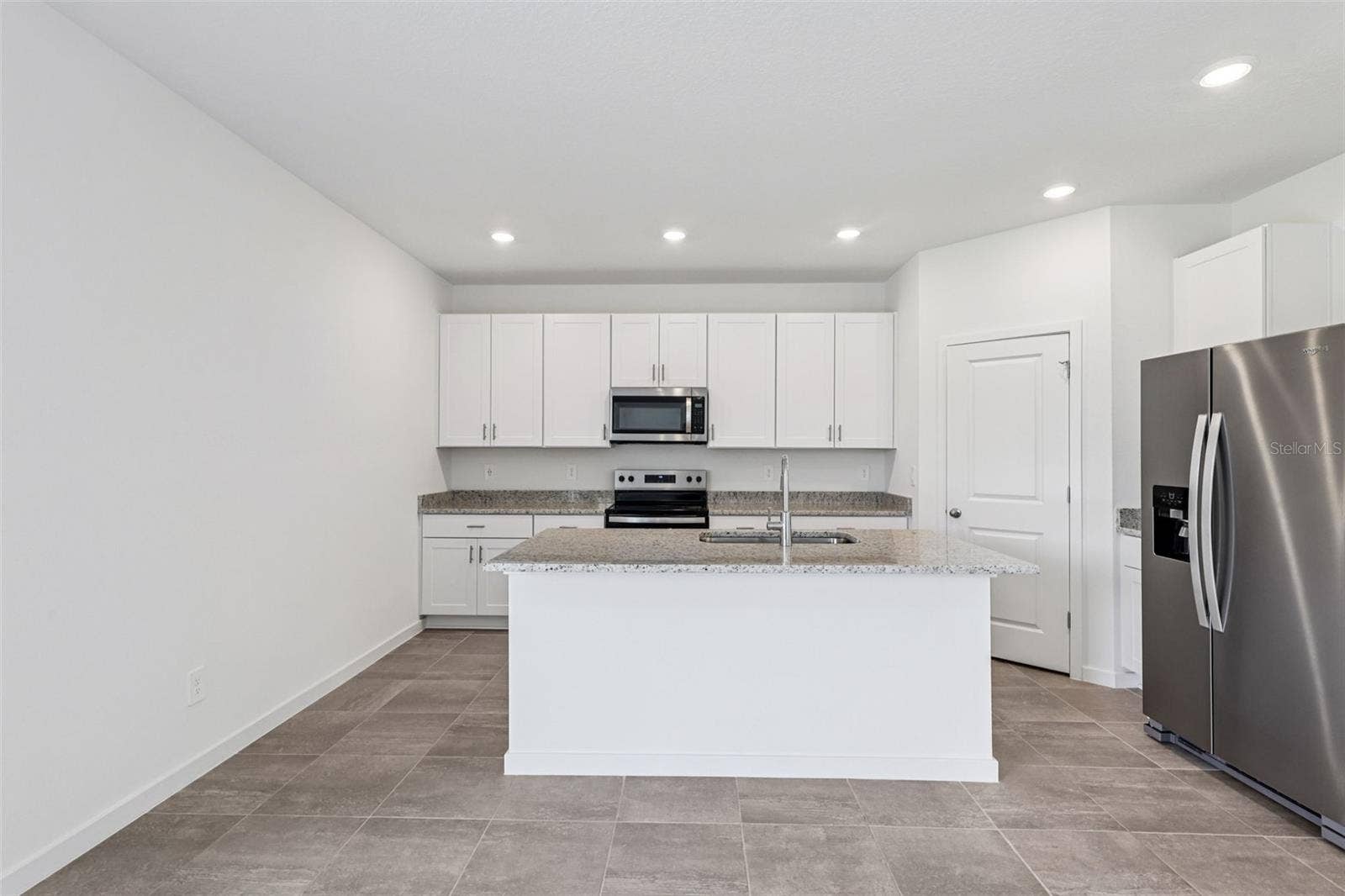 The interior photos are of another home with the same floor plan but different interior color package finishes. Some details may vary