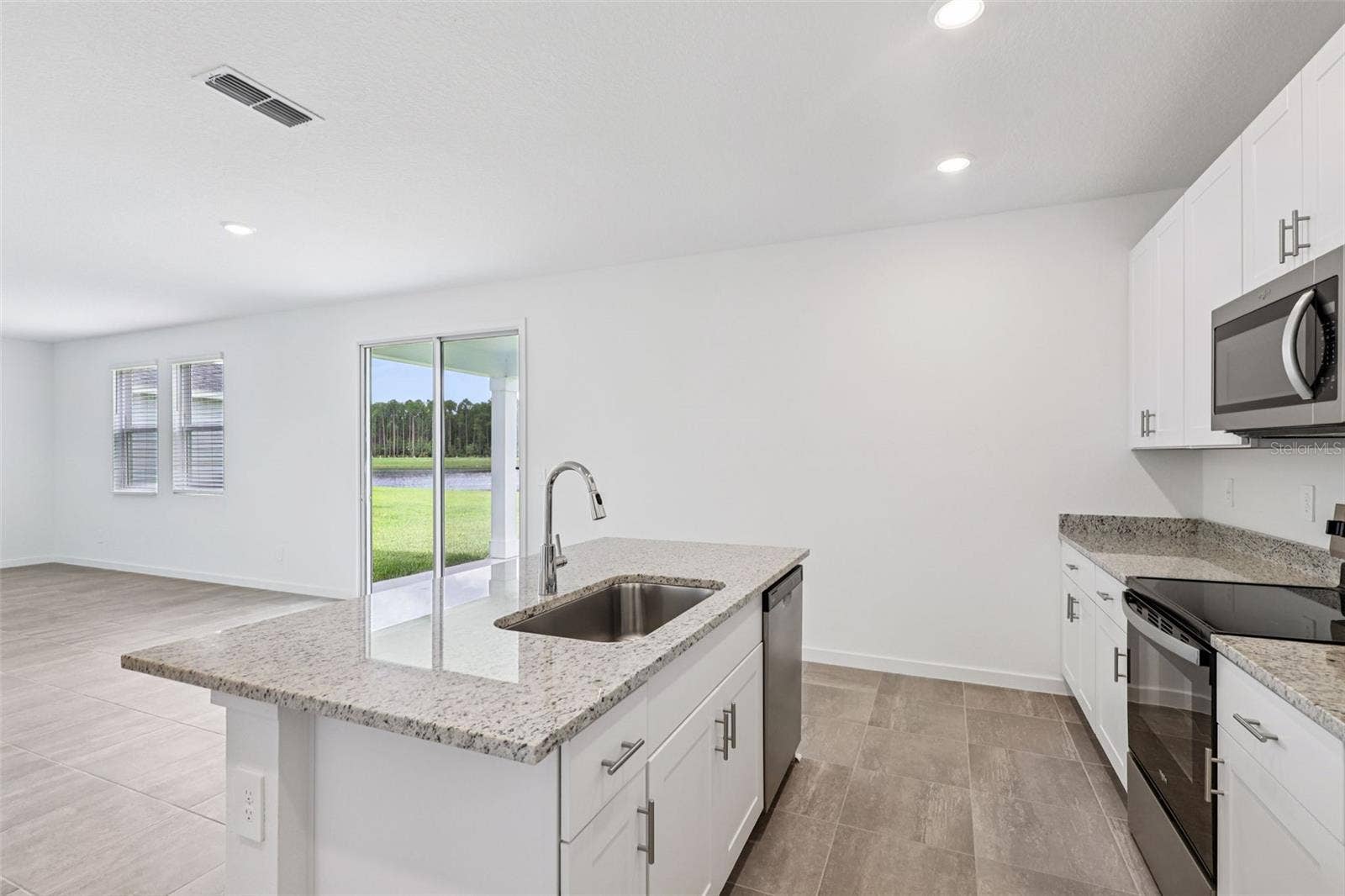 The interior photos are of another home with the same floor plan but different interior color package finishes. Some details may vary