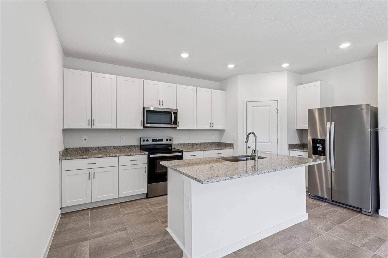 The interior photos are of another home with the same floor plan but different interior color package finishes. Some details may vary